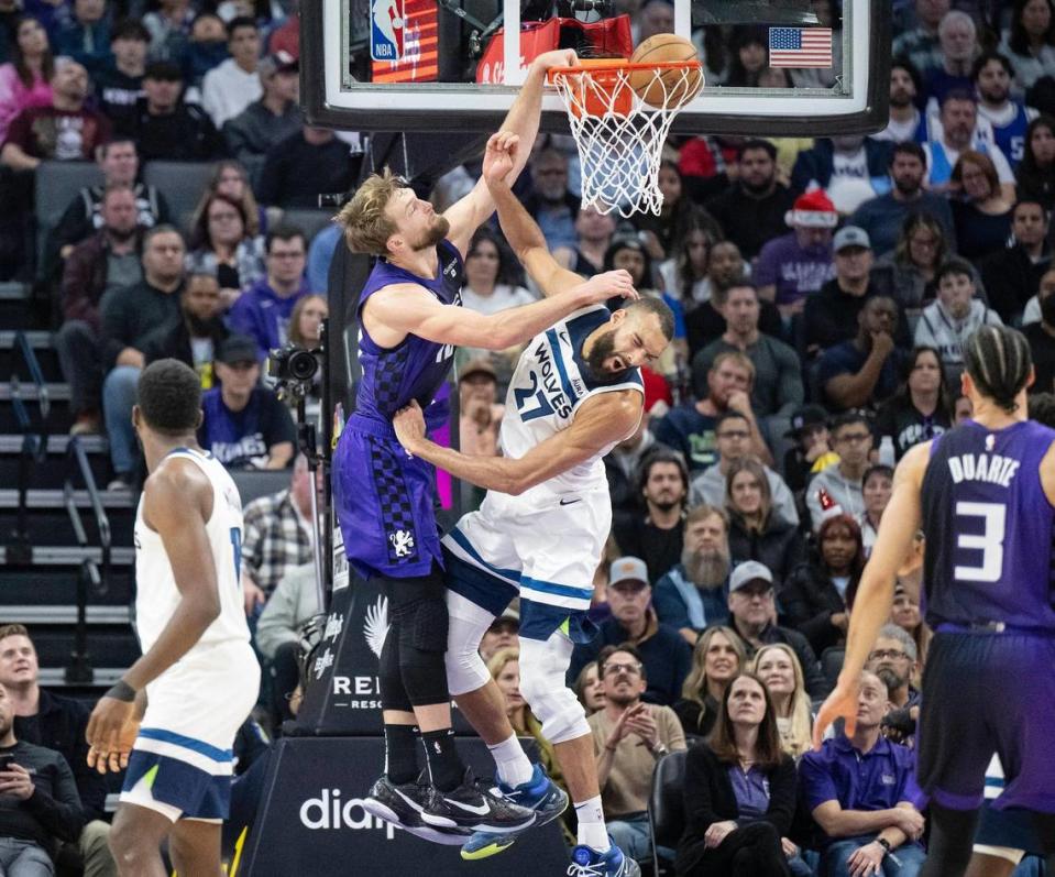 Sacramento Kings center Domantas Sabonis (10) dunks on Minnesota Timberwolves center Rudy Gobert (27) in the second half of the NBA basketball game on Saturday, Dec. 23, 2023, at Golden 1 Center. Sabonis had a triple-double with 17 points 10 rebounds and 10 assists.