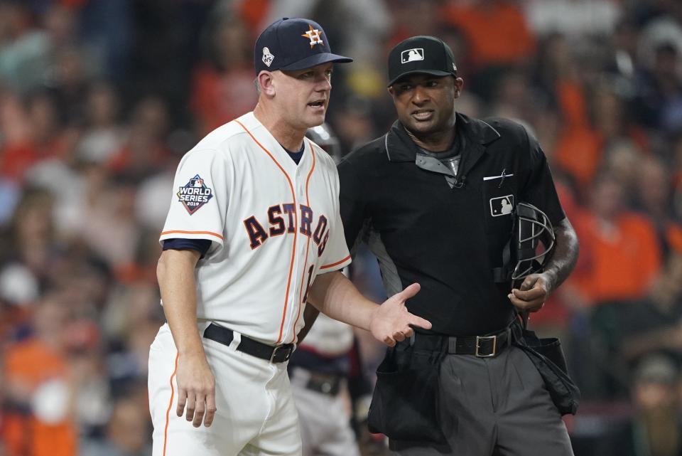 Houston Astros manager AJ Hinch argues a call with home plate umpire Alan Porter during the fourth inning of Game 1 of the baseball World Series against the Washington Nationals Tuesday, Oct. 22, 2019, in Houston. (AP Photo/David J. Phillip)
