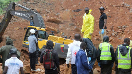 Rescue workers search for survivors after a mudslide in the Mountain town of Regent, Sierra Leone, August 14, 2017. Pictures taken August 14, 2017. Sierra Leone Red Cross/Handout via REUTERS