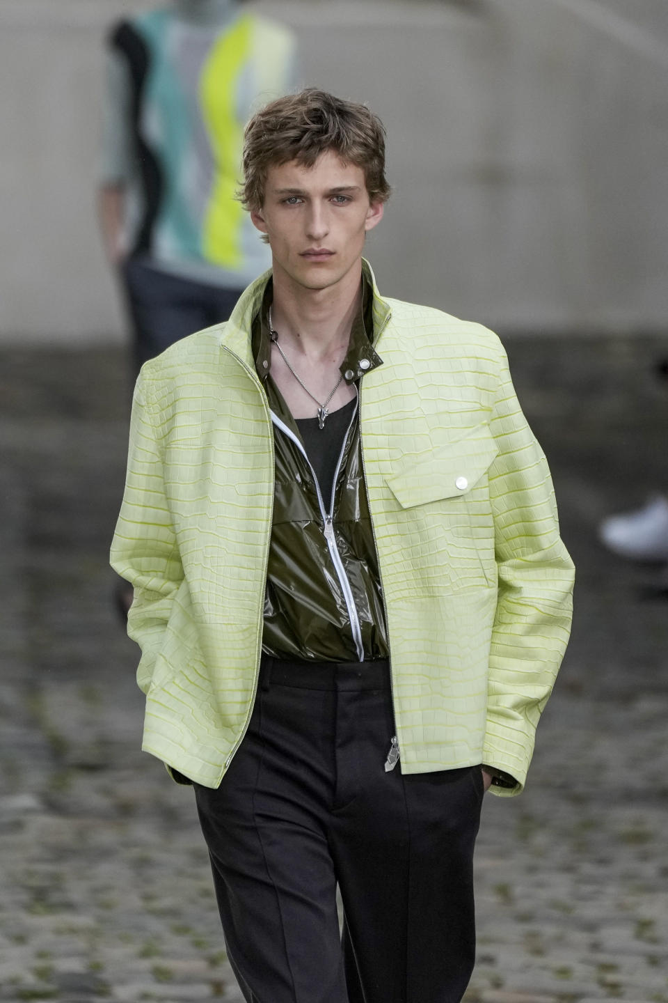 A model wears a creation as part of the Hermes men's Spring Summer 2023 collection presented in Paris, France, Saturday, June 25, 2022. (AP Photo/Francois Mori)