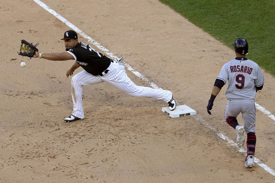 Chicago White Sox first baseman Jose Abreu stretches for a throw from relief pitcher Aaron Bummer to get Cleveland Indians' Eddie Rosario out at first during the ninth inning of a baseball game Saturday, May 1, 2021, in Chicago. The White Sox won 7-3. (AP Photo/Charles Rex Arbogast)