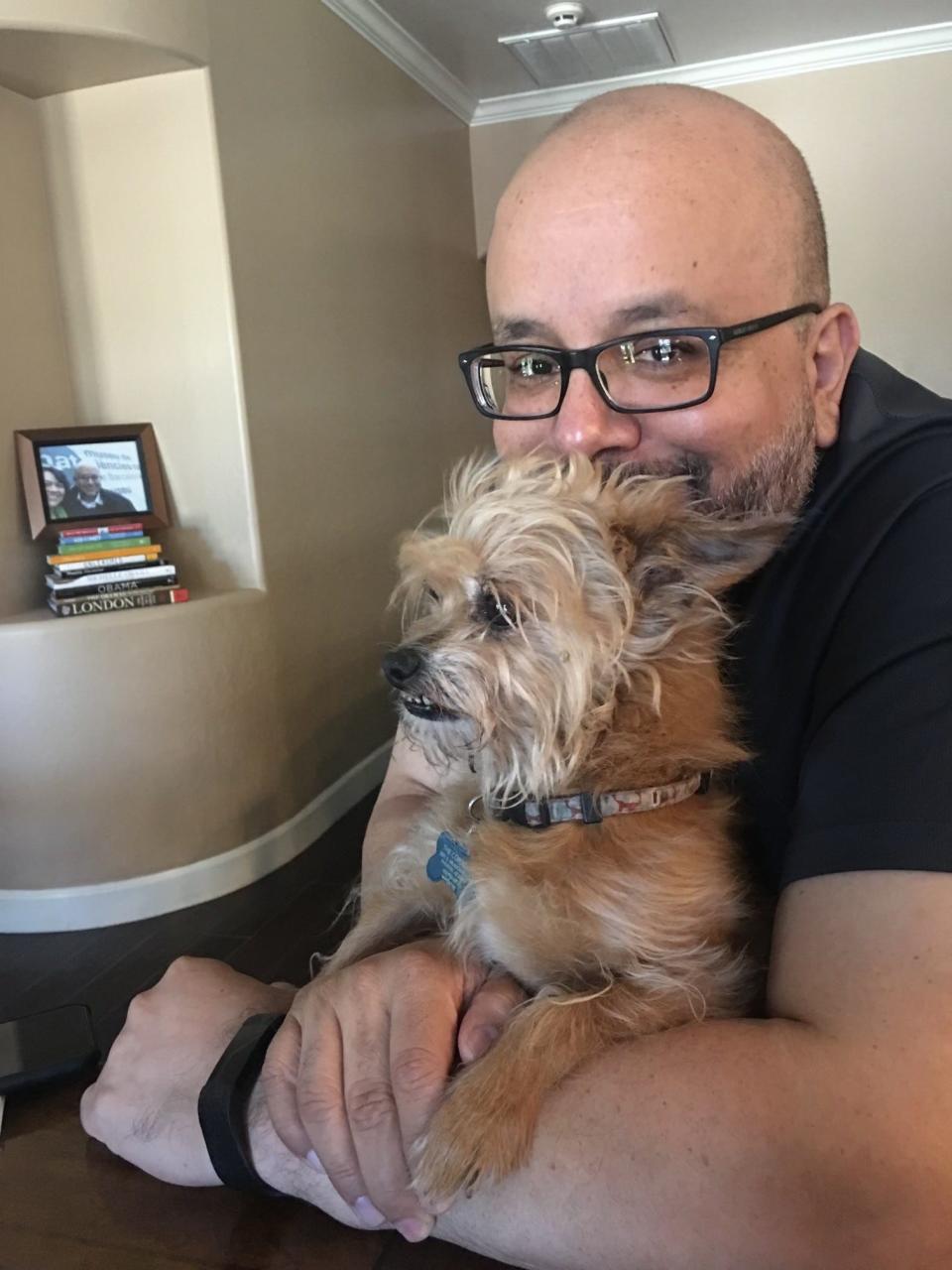 Randy Cordova and his dog, Lou, named for Lou Grant