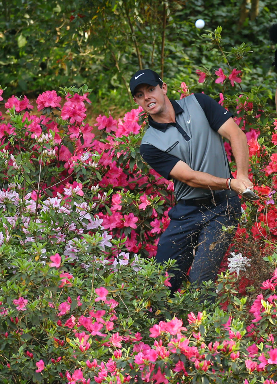 Rory McIlroy, of Northern Ireland, hits from the azaleas on No. 13 during the second round of the Masters golf tournament, Friday, April 11, 2014, in Augusta, Ga. (AP Photo/Atlanta Journal Constitution, Curtis Compton) MARIETTA DAILY OUT; GWINNETT DAILY POST OUT; WXIA OUT; WGCL OUT; FOX 5 OUT