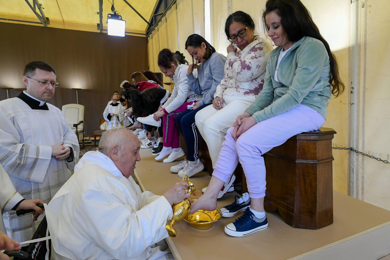 In this image made available by Vatican Media, Pope Francis washes and kisses the feet of 12 women inmates of the Rebibbia prison in the outskirts of Rome on Holy Thursday, March 28, 2024, a ritual meant to emphasize his vocation of service and humility.  / Credit: Vatican Media / AP