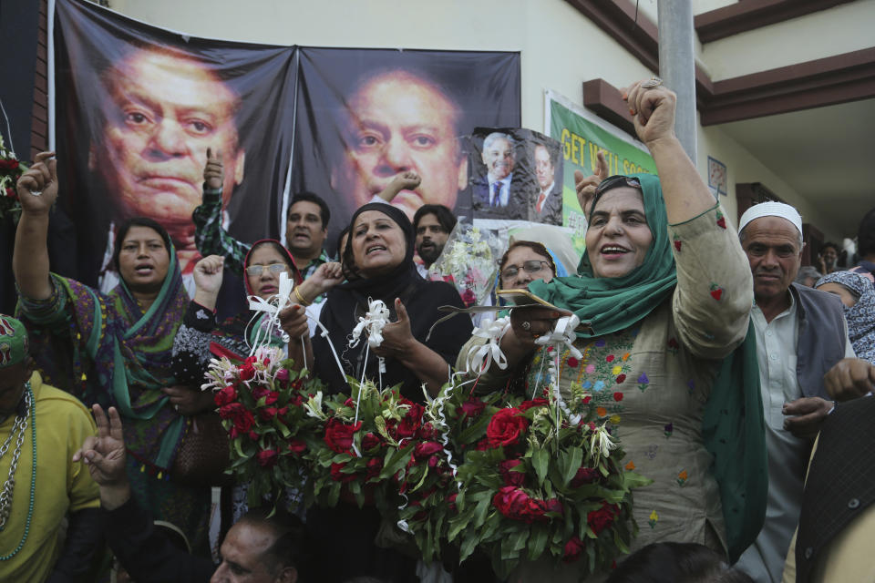 Supporters of Pakistani former Prime Minister Nawaz Sharif celebrate the release of their leader, outside a hospital where Sharif admitted in Lahore, Pakistan, Friday, Oct. 25, 2019. A top Pakistani court on Friday ordered convicted former Sharif released on bail so he can seek medical treatment at home or abroad, his family and a defense lawyer said. (AP Photo/K.M. Chaudary)
