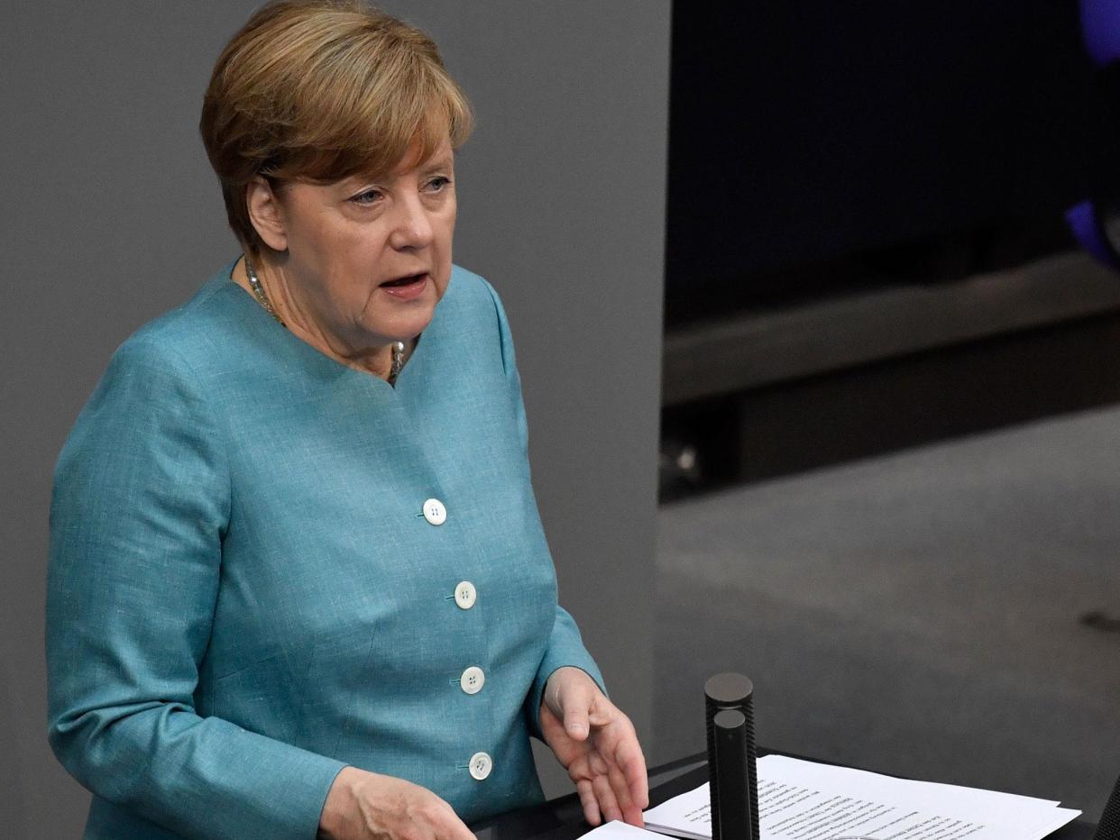 The German Chancellor stressed in a speech to the German parliament the EU stands fully behind its commitment to the Paris climate change agreement: Getty