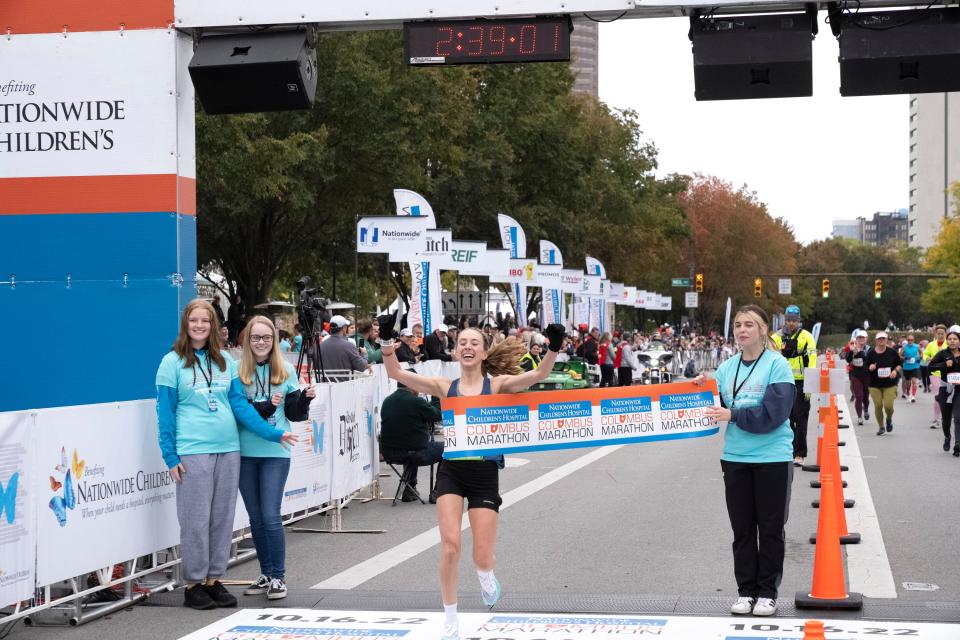 Oct 16, 2022; Columbus, Ohio, USA;  Sarah Biehl crosses the finish line, winning the full women’s division of the Columbus Marathon. Mandatory Credit: Joseph Scheller-The Columbus Dispatch