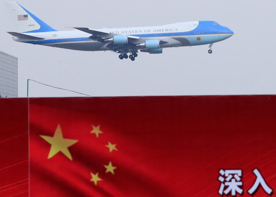 U.S. President Donald Trump and first lady Melania arrive on Air Force One in Beijing, China, November 8, 2017. REUTERS/Aly Song