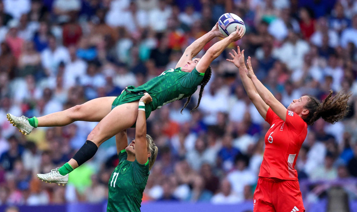 Emily Lane of Ireland and Erin King of Ireland in action with Lauren Torley of Britain during the Rugby Sevens - Women's Placing 7-8 on July 30, 2024 in Saint-Denis, France. (Phil Noble/Reuters)