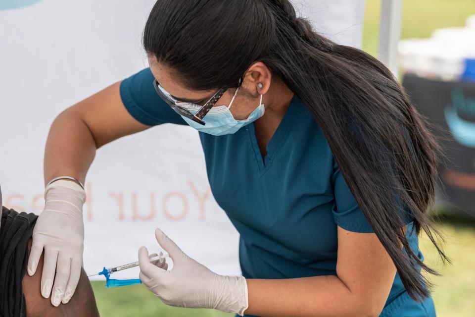Medical student Gujit Mundh injects Moderna vaccine during a COVID vaccination clinic for the homeless in Tulare on Thursday, August 19, 2021. 