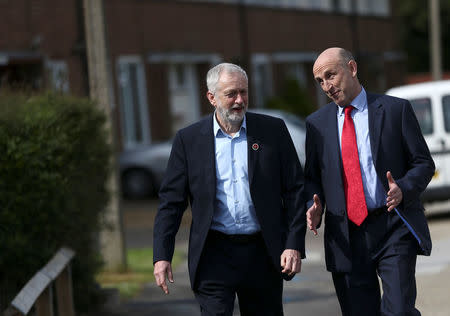 Jeremy Corbyn the leader of Britain's opposition Labour Party arrives with local MP John Healey at a house in Harlow, Essex, April 27, 2017. REUTERS/Neil Hall