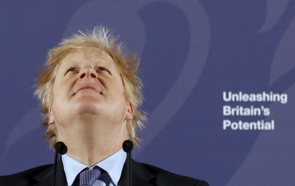 Britain's Prime Minister Boris Johnson reacts as he delivers a speech at the Old Royal Naval College in Greenwich, south east London on February 3, 2020. - Britain on Monday said it wanted a "thriving trade and economic relationship" with the European Union, as it set out its position for future trade talks after it left the bloc. But Prime Minister Boris Johnson pledged: "We will not engage in some cut-throat race to the bottom. We are not leaving the EU to undermine European standards. We will not engage in any kind of dumping, whether commercial, social or environmental." (Photo by Frank Augstein / various sources / AFP) (Photo by FRANK AUGSTEIN/AP/AFP via Getty Images)