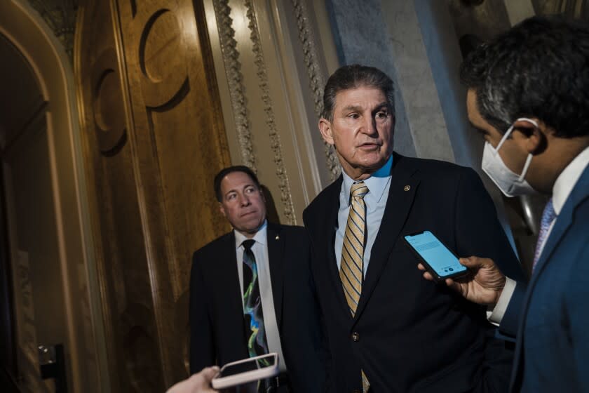 WASHINGTON, DC - FEBRUARY 17: Sen. Joe Manchin (D-WV) stops to chat with reporters outside the Senate Chamber on Capitol Hill on Thursday, Feb. 17, 2022 in Washington, DC. (Kent Nishimura / Los Angeles Times)