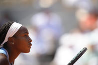 Coco Gauff of the U.S. concentrates for the service of Poland's Iga Swiatek during their quarterfinal match of the French Open tennis tournament at the Roland Garros stadium in Paris, Wednesday, June 7, 2023. (AP Photo/Christophe Ena)
