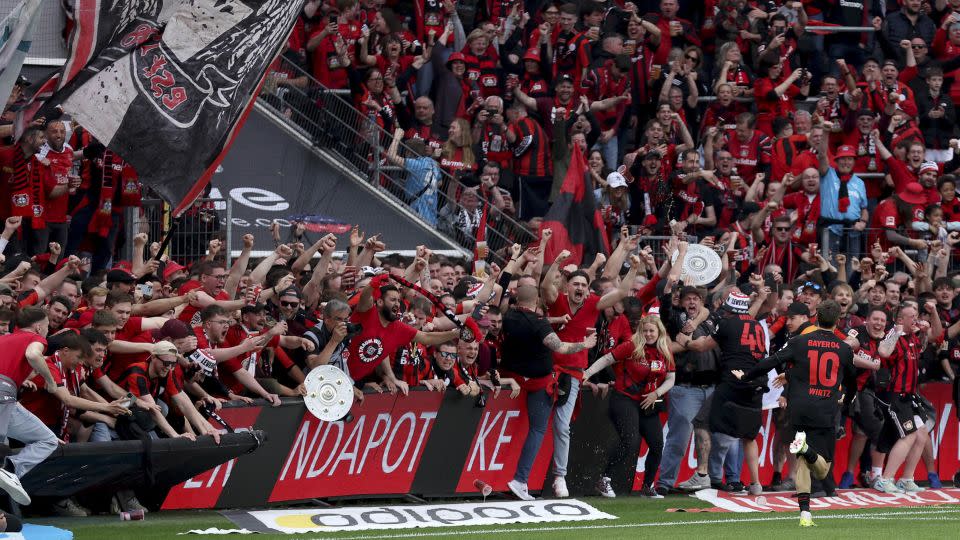 Wirtz and Leverkusen fans celebrate after the German international scored the team's fourth goal against Werder Bremen. - Lars Baron/Getty Images