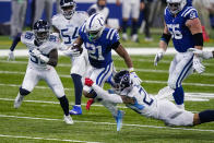 Tennessee Titans strong safety Kenny Vaccaro (24) tackles Indianapolis Colts running back Nyheim Hines (21) in the first half of an NFL football game in Indianapolis, Sunday, Nov. 29, 2020. (AP Photo/Darron Cummings)