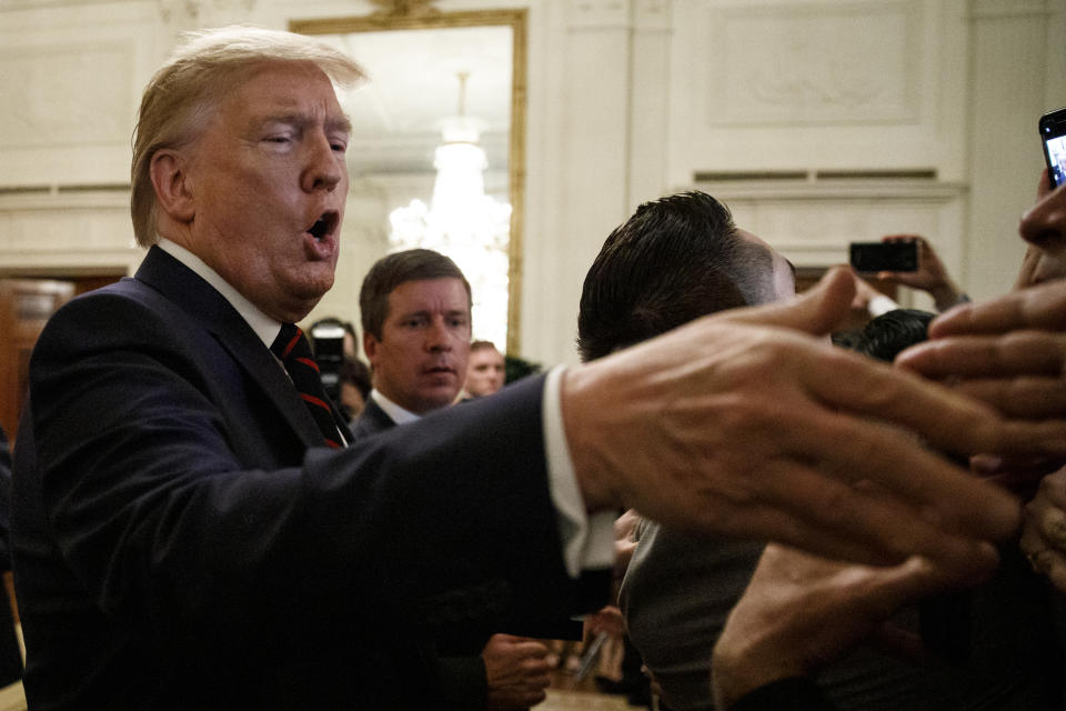 President Donald Trump greets people in the audience at the Hispanic Heritage Month Reception in the East Room of the White House in Washington, Friday, Sept. 27, 2019. (AP Photo/Carolyn Kaster)