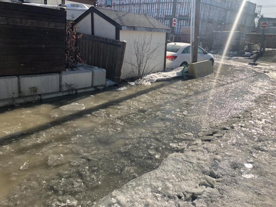 Water pooling in a residential neighbourhood of Yellowknife. The neighbourhood has dealt with seven water main breaks since February.