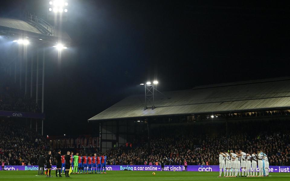 Players pause to remember those affected by the war between Israel and Hamas militants that has devastated much of Gaza, ahead of the English Premier League football match between Crystal Palace and Tottenham Hotspur at Selhurst Park