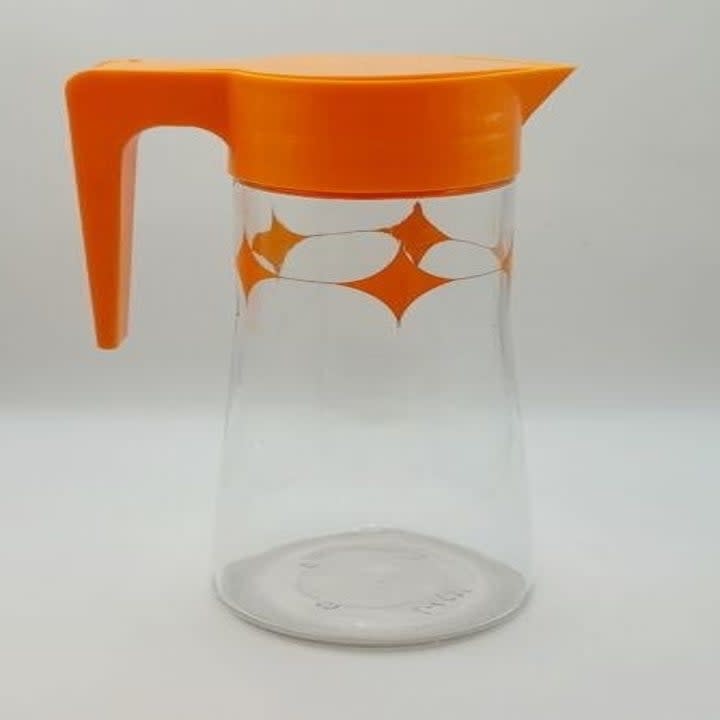 pitcher with an orange lid