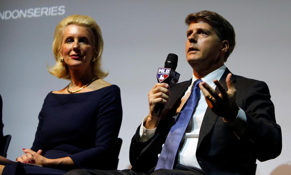 Hal Steinbrenner, right, a joint owner of the New York Yankees, answers a question from the media press conference in London, Tuesday, May 8, 2018, to announce a two game series to be played in London.