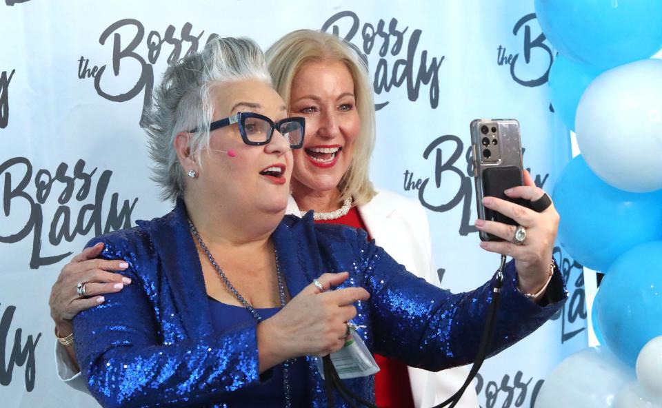 Motivational speaker/author Pegine, left, films a live video post on social media with Teresa Rand, founder of the Boss Lady Leadership Community, before the start of the third-annual two-day Boss Lady Women's Leadership Conference on Thursday, Sept. 14, 2023 at the Daytona Grande Oceanfront Resort in Daytona Beach.