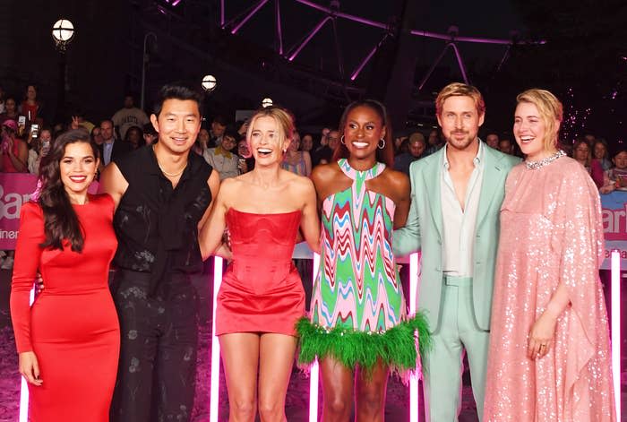 some of the cast posing at a press event