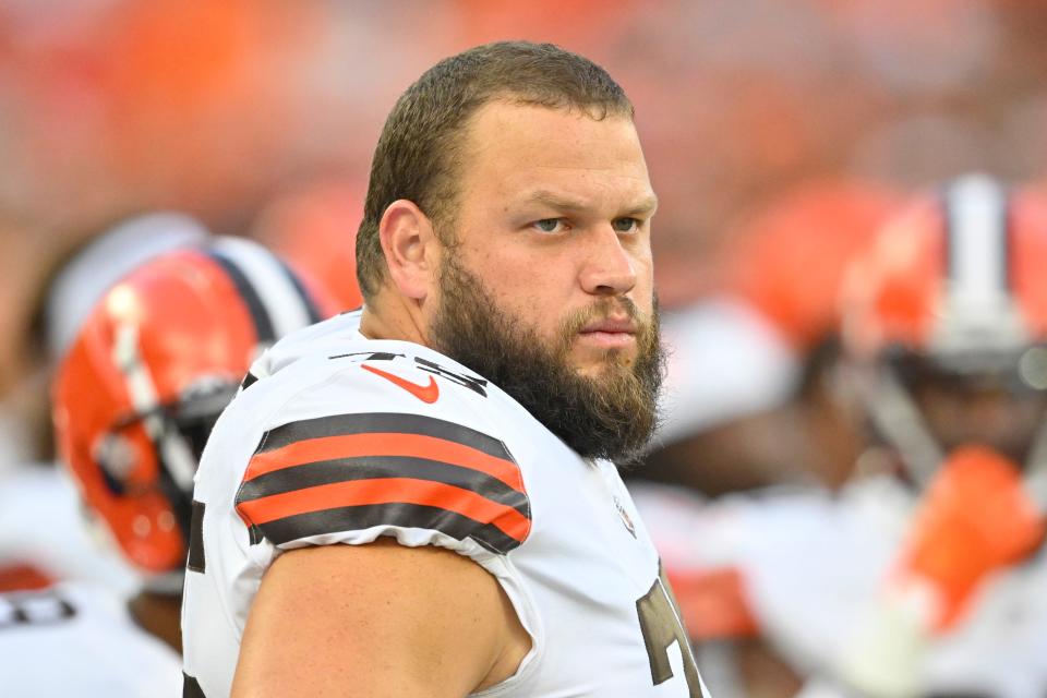 FILE - Cleveland Browns guard Joel Bitonio stands on the field during an NFL preseason football game against the Chicago Bears, Saturday, Aug. 27, 2022, in Cleveland. Amid a multitude of missteps, there's one statistic that underscores the Browns' misery since their expansion reboot in 1999 better than any other. They're 1-21-1 in openers. All-Pro left guard Bitonio couldn't help but smile when asked where winning an opener is on his bucket list. (AP Photo/David Richard, File)