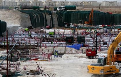 Foreign laborers work at the construction site of the al-Wakrah football stadium in Qatar. (AFP)