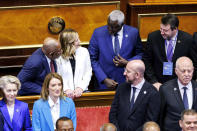 Italian Premier Giorgia Meloni, back row second from left, shares a smile with African Union Commission Chairperson Moussa Faki Mahamat, second from right, Vice President of the Council of Ministers of Italy Matteo Salvini, right, and African Union President Azali Assoumani, left, as front row from left, President of the European Commission Ursula von der Leyen, President of the European Parliament Roberta Metsola, President of the European Council Charles Michel and President of Tunisia Kais Saied stand on, at the Senate for the start of an Italy - Africa summit, in Rome, Monday, Jan. 29, 2024. Meloni opened a summit of African leaders on Monday aimed at illustrating Italy's big development plan for the continent that her government hopes will stem migration flows and forge a new relationship between Europe and Africa. (Roberto Monaldo/LaPresse via AP)