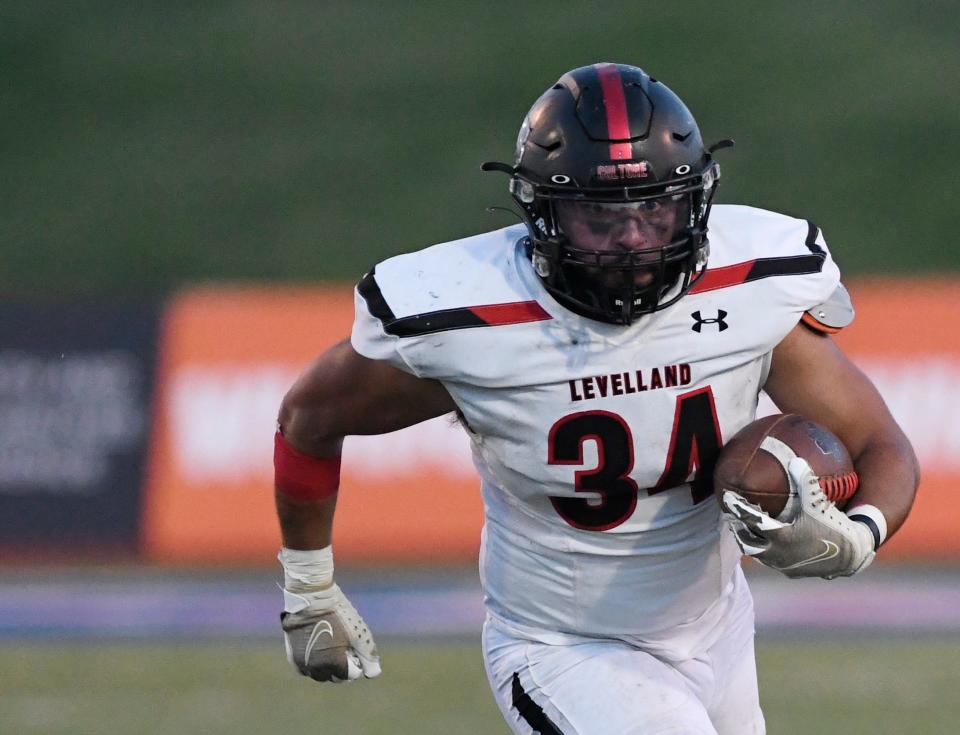 Levelland's Marco Guillen runs with the ball against Lubbock High, Thursday, Sept. 8, 2022, at Lowrey Field at PlainsCaptial Park. Lubbock High won, 21-14.