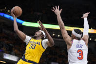 Indiana Pacers center Myles Turner (33) drives to the basket over New York Knicks guard Josh Hart (3) during the second half of Game 3 in an NBA basketball second-round playoff series, Friday, May 10, 2024, in Indianapolis. (AP Photo/Michael Conroy)