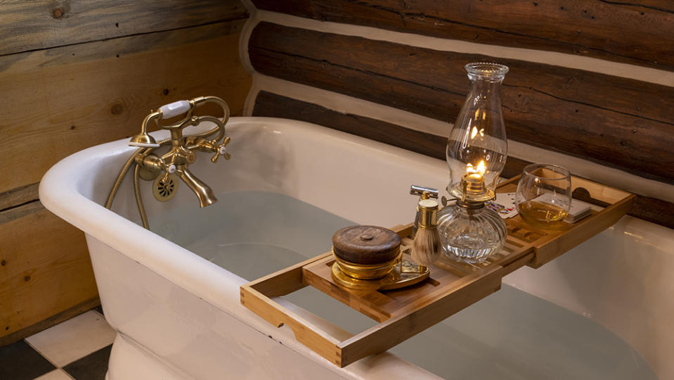 A welcome vintage clawfoot soaking tub in Tie Hack Cabin at 3 Spears Ranch