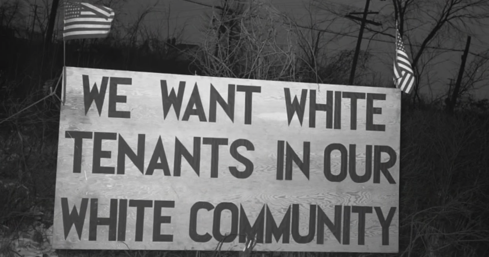 A sign that says, "We want white tenants in our white community"