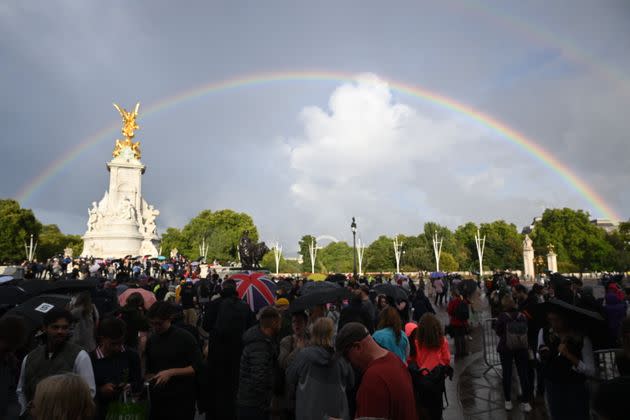 A faint rainbow is seen over a more vivid one outside of Buckingham Palace Thursday. (Photo: Leon Neal via Getty Images)