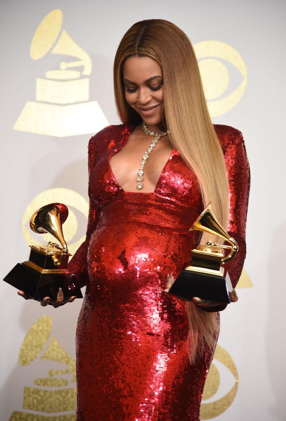 <p>Shortly before performing at the 59th Annual Grammy Awards, Beyoncé revealed on social media that she was <a href="https://www.rollingstone.com/music/music-news/beyonce-announces-she-is-pregnant-with-twins-122303/" rel="nofollow noopener" target="_blank" data-ylk="slk:pregnant with twins;elm:context_link;itc:0;sec:content-canvas" class="link ">pregnant with twins</a>. The singer showed off her bump while accepting two Grammys for <em>Lemonad</em><em>e. </em>The couple welcomed <a href="https://www.elle.com/uk/life-and-culture/a30377823/beyonce-twins-rumi-sir-carter/" rel="nofollow noopener" target="_blank" data-ylk="slk:Rumi and Sir Carter;elm:context_link;itc:0;sec:content-canvas" class="link ">Rumi and Sir Carter</a> on June 13, 2017. </p>