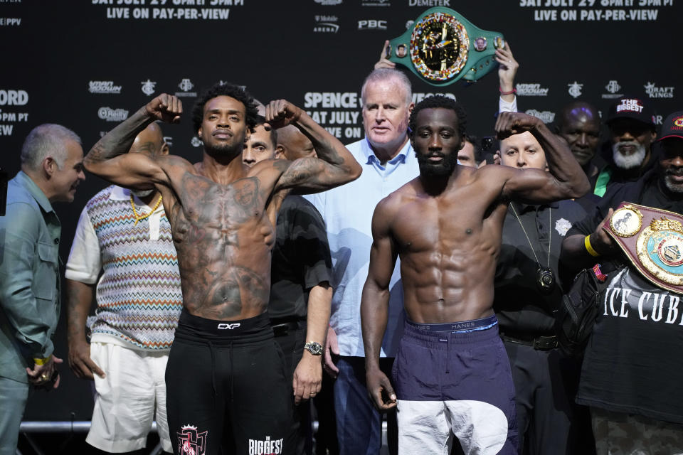 Errol Spence Jr., left, and Terence Crawford pose during a weigh-in for their upcoming fight Friday, July 28, 2023, in Las Vegas. The two are scheduled to fight in an undisputed welterweight championship boxing match Saturday in Las Vegas. (AP Photo/John Locher)