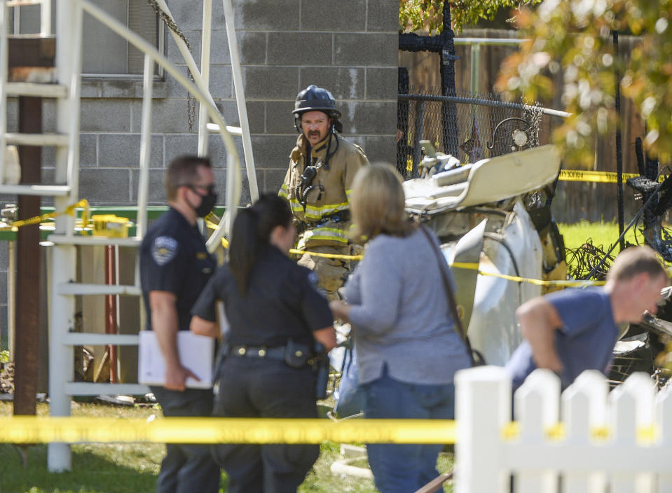 Emergency crews respond to a small plane crash, Saturday, July 25, 2020, in West Jordan, Utah. (Leah Hogsten/The Salt Lake Tribune via AP)