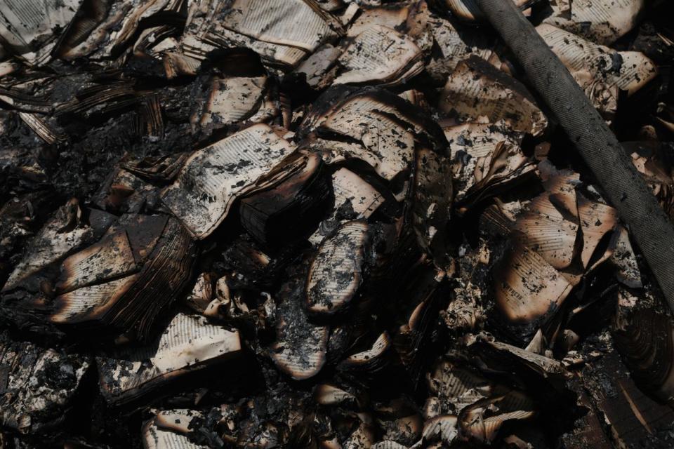 Burned Ukrainian books at the site of a Russian missile attack on a publishing factory in Kharkiv, Ukraine on May 23, 2024. (Francis Farrell/The Kyiv Independent)