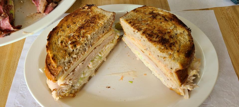 "Marci's Main Mover" is turkey, Swiss, slaw on grilled rye with Russian dressing on the side at Larry's Lunchbox, $15.