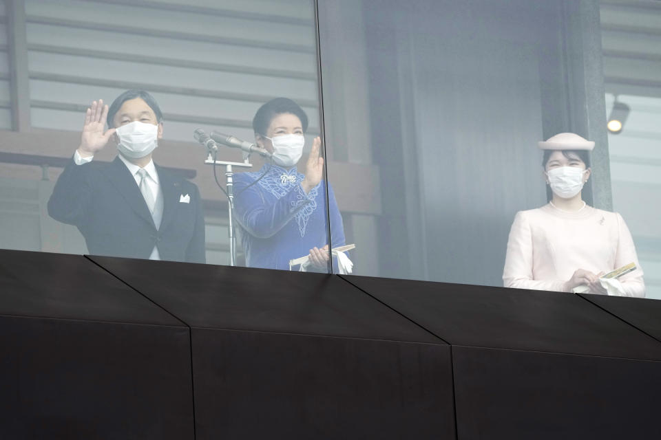 Japan's Emperor Naruhito, with Empress Masako and their daughter Princess Aiko, greets well-wishers as they appear on the balcony of the Imperial Palace to mark the emperor's 63rd birthday in Tokyo Thursday, Feb. 23, 2023. (AP Photo/Eugene Hoshiko, Pool)