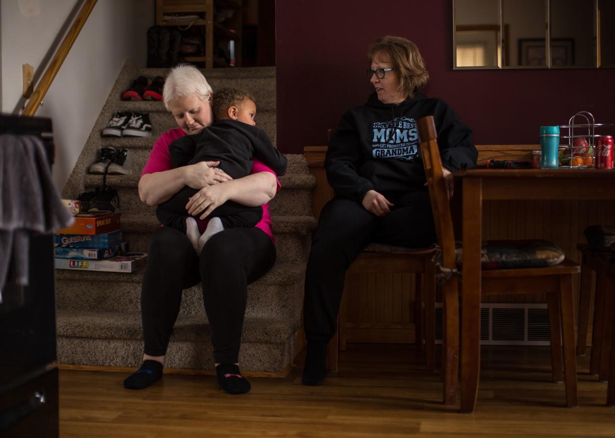 Kim Voelker-Wesley, 41, of Montrose hugs her son Cameron Wesley, 3, as her mother Terrie Gronau of Montrose looks on while sitting in the dining room of her home in Montrose on Thursday, January 3, 2019.
Voelker-Wesley is battling skin cancer that spread to her breast, lungs and liver after being in remission for five years. The disease has robbed her of her livelihood and independence, but not her hopes. She has one New Year's Resolution: to live.