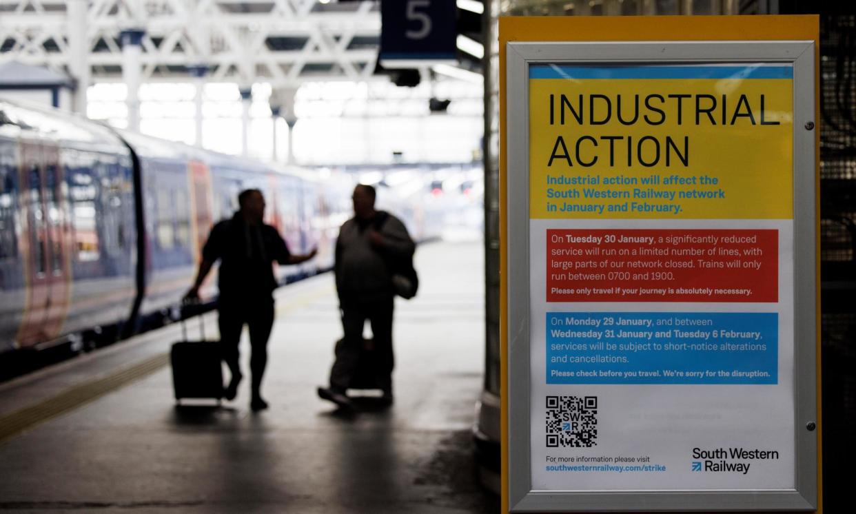 <span>A sign informing passengers about industrial action at Waterloo station in January 2024. </span><span>Photograph: Tolga Akmen/EPA</span>