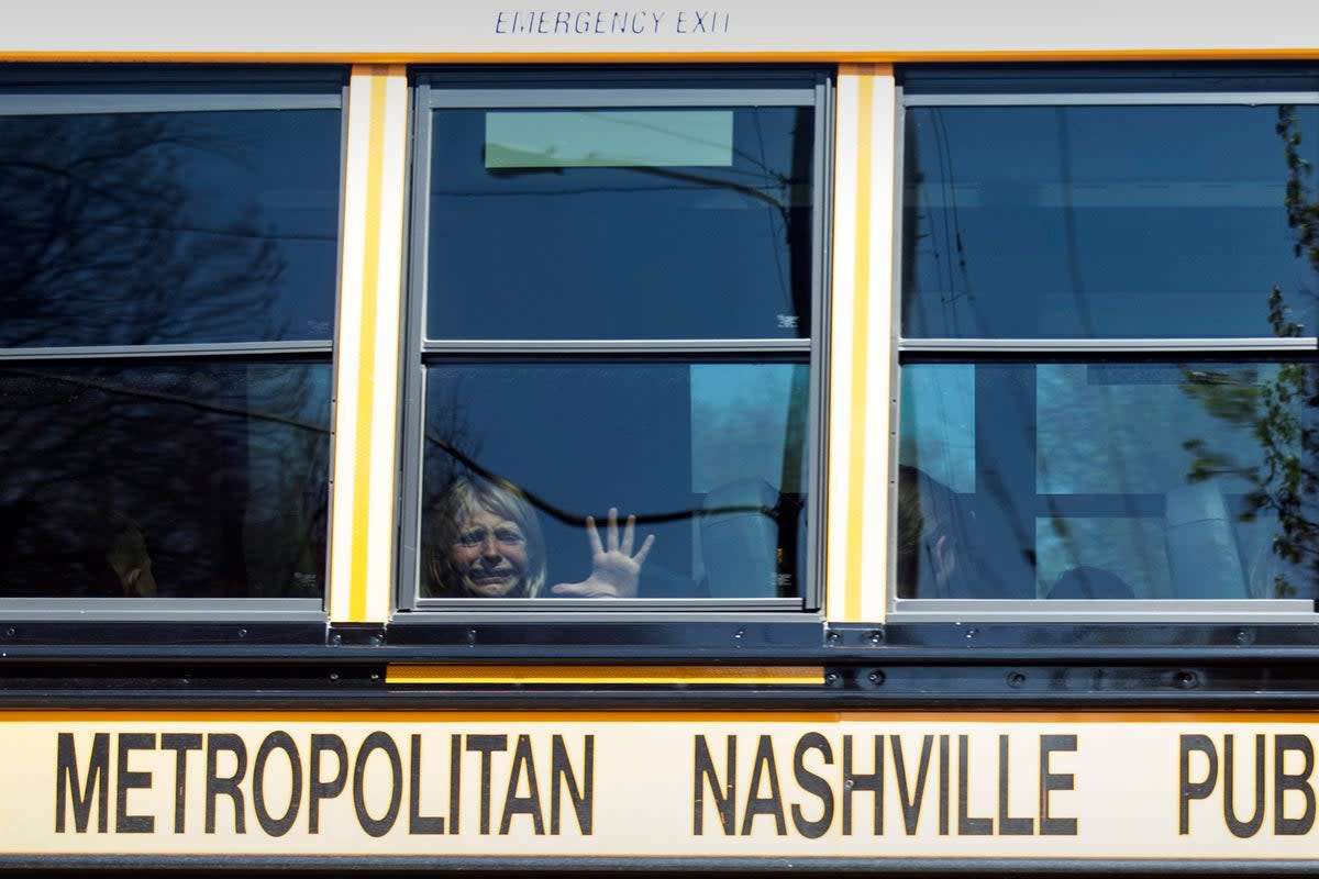 A child weeps while on the bus leaving The Covenant School following a mass shooting at the school in Nashville (THE TENNESSEAN)