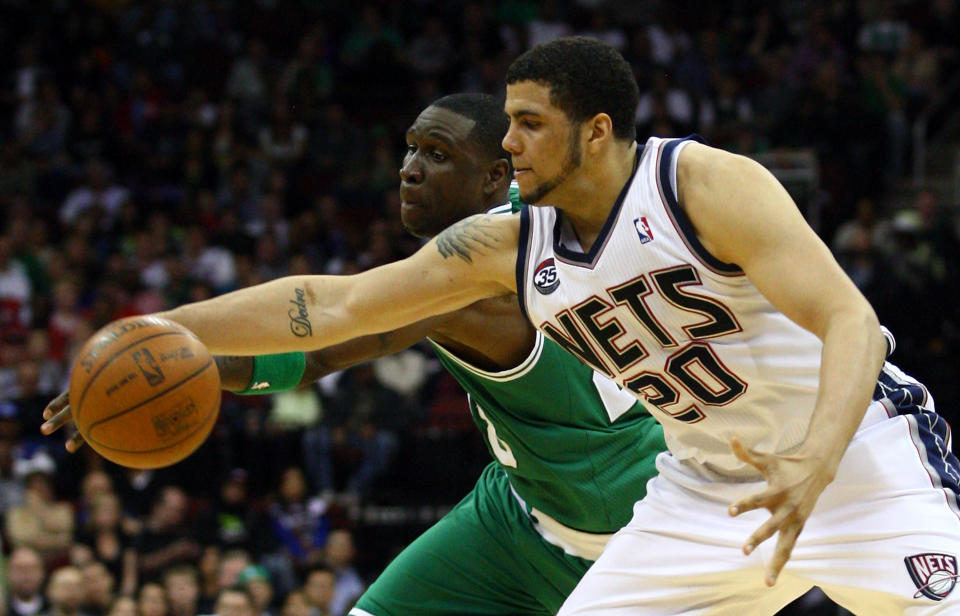 NEWARK, NJ - APRIL 14: Jordan Williams #20 of the New Jersey Nets reaches for a loose ball in the second half against Mickael Pietrus #28 of the Boston Celtics at Prudential Center on April 14, 2012 in Newark, New Jersey. NOTE TO USER: User expressly acknowledges and agrees that, by downloading and or using this photograph, User is consenting to the terms and conditions of the Getty Images License Agreement. (Photo by Chris Chambers/Getty Images)