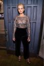 <p>So sexy and chic, JLaw stuns in a gorgeous metallic see-through top paired with some black tailored pants during The Dinner For Equality co-hosted by Patricia Arquette and Marc Benioff on February 25, 2016 in Beverly Hills.</p>