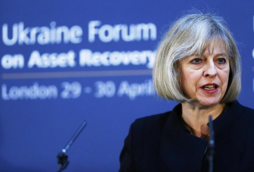 Britain's Home Secretary Theresa May speaks at the Ukraine Forum on Asset Recovery in central London, Tuesday April 29, 2014. Britain and the United States are co-hosting the two-day "asset recovery forum" designed to help find and recover assets believed to have been stolen by the regime of ousted Ukrainian president Viktor Yanukovych. (AP Photo/Andrew Winning, Pool)