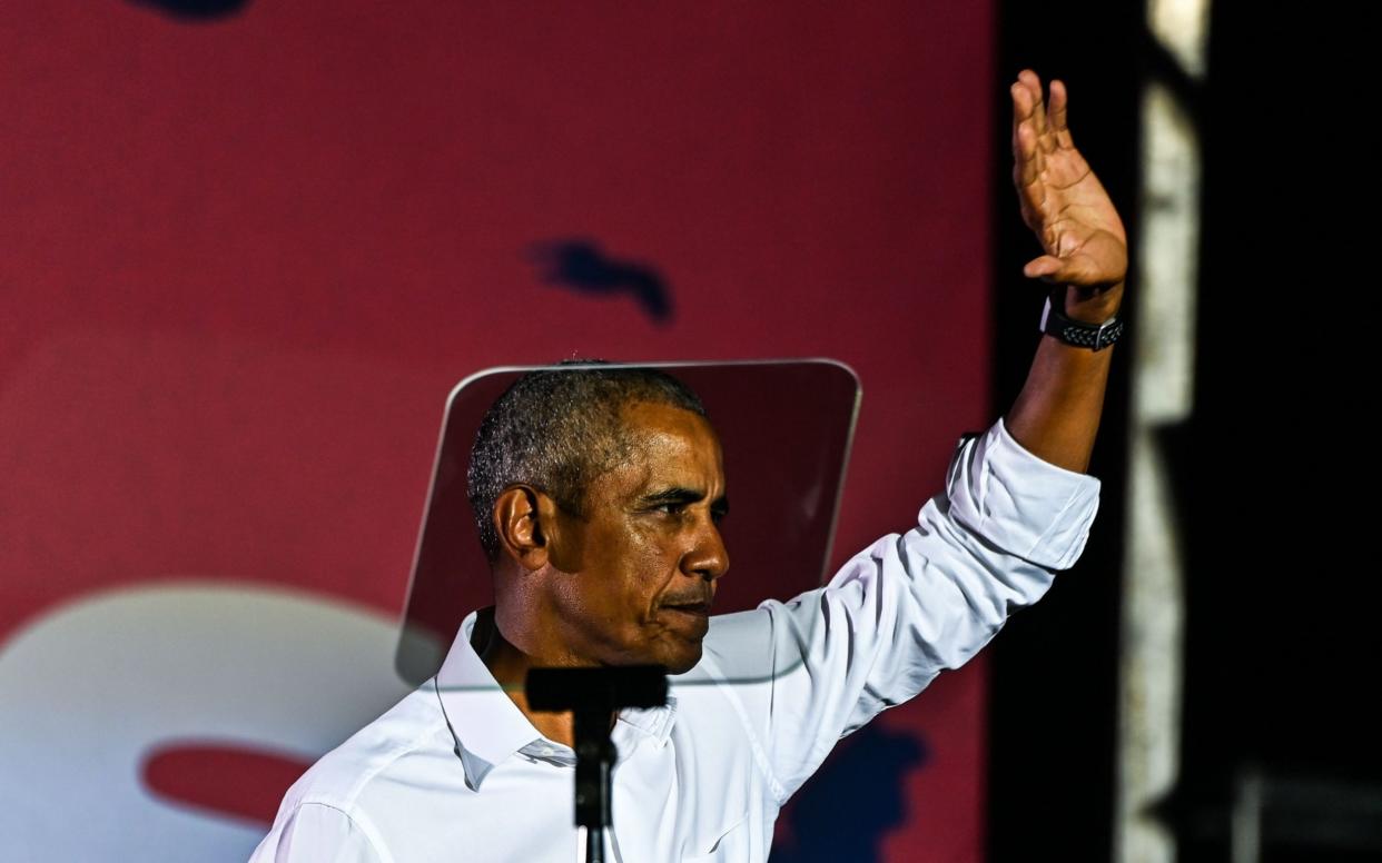 Former US President Barack Obama attends a drive-in rally as he campaigns for Democratic presidential candidate former Vice President Joe Biden in Miami - AFP