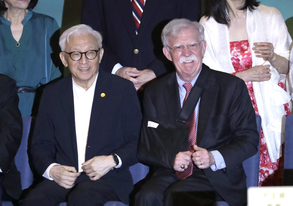 Former US national security advisor John Bolton, right, and the founder of United Microelectronics Corporation (UMC) Robert Tsao smile at the 40th anniversary celebration of Formosan Association for Public Affairs in Taipei, Taiwan, Monday, May 1, 2023. (AP Photo/ Chiang Ying-ying)