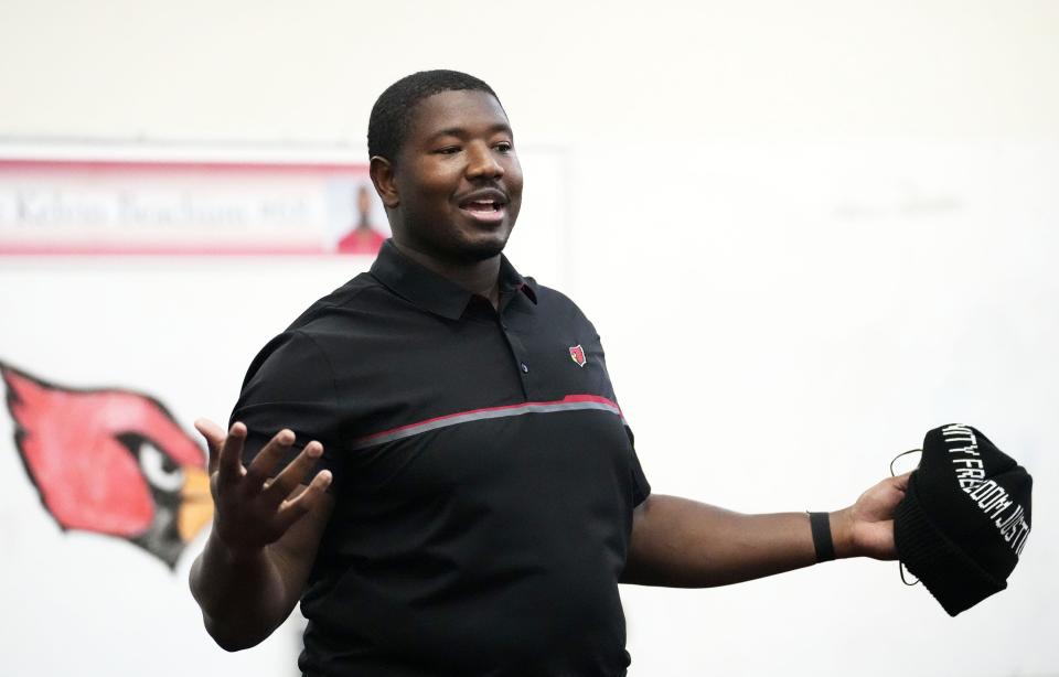 Jan 11, 2022; Phoenix, Arizona, USA; Arizona Cardinals offensive lineman Kelvin Beachum and the Cardinals donated 40-plus Microsoft computers to middle school students at the C.O. Greenfield School. Beachum is the Cardinals' nominee for the Walter Payton Man of the Year Award. Mandatory Credit: Rob Schumacher-Arizona Republic